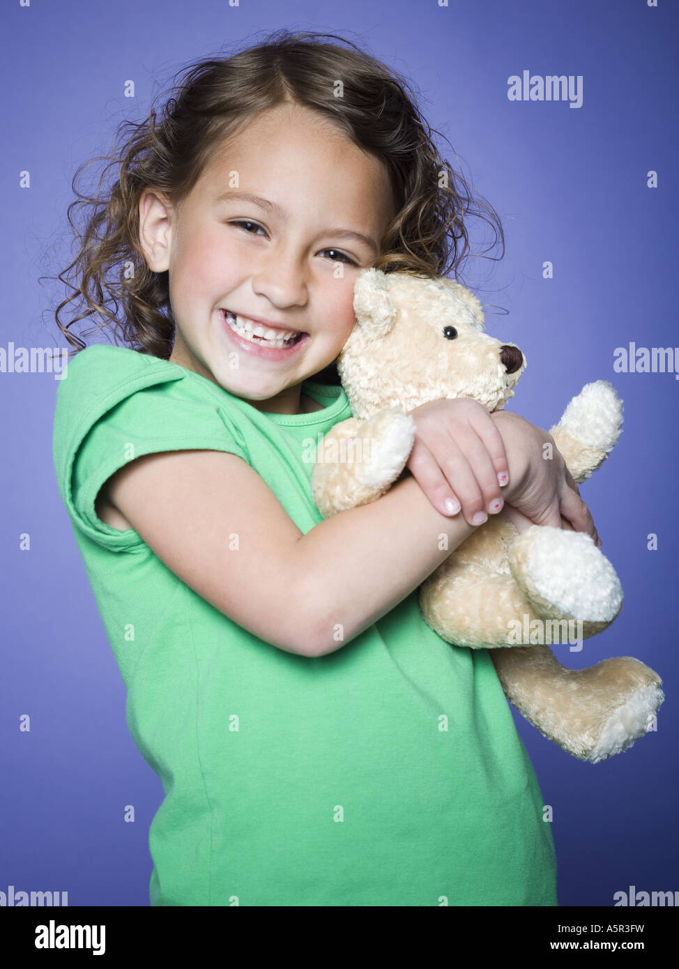 Portrait of a girl holding a teddy bear Stock Photo - Alamy