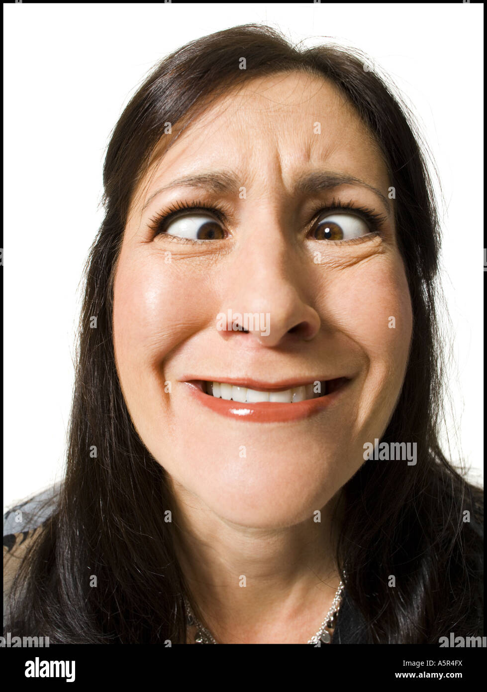 Closeup of woman with crossed eyes making funny face Stock Photo Alamy