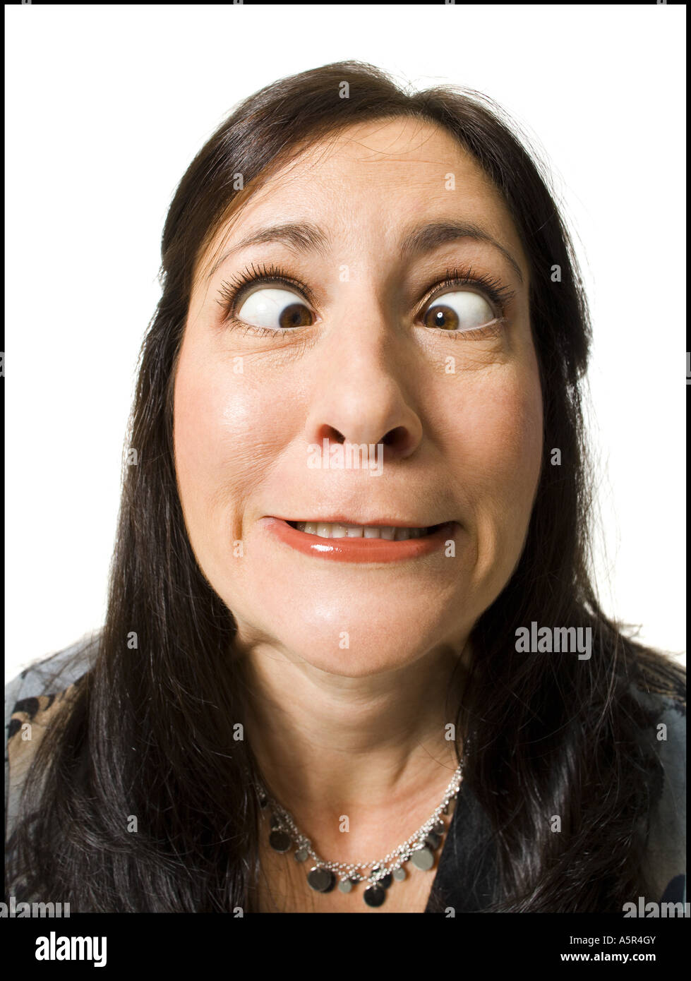 Closeup of woman with crossed eyes making funny face Stock Photo Alamy