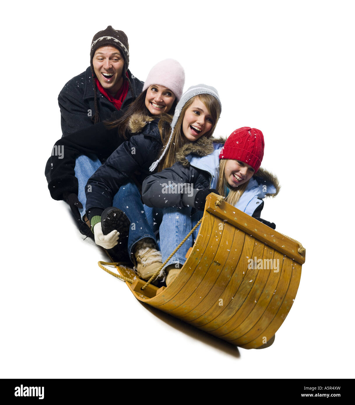 Family on toboggan Stock Photo Alamy