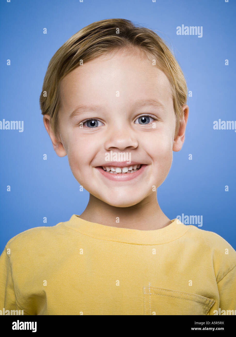 Portrait of a young boy smiling Stock Photo - Alamy