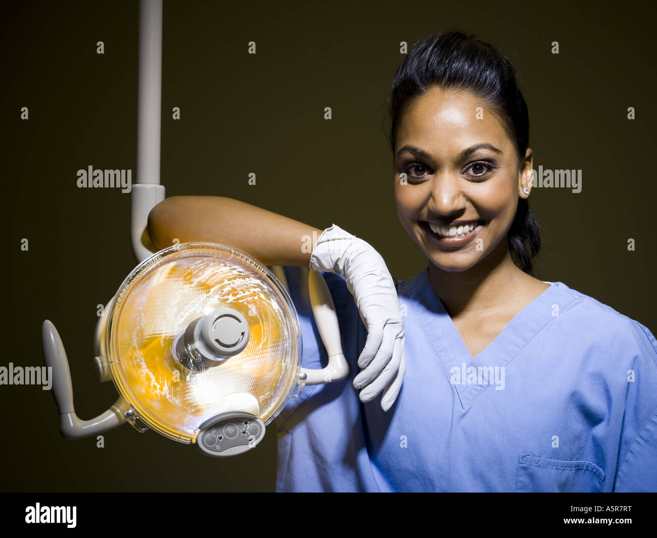 Woman in nurses uniform leaning on medical light Stock Photo Alamy