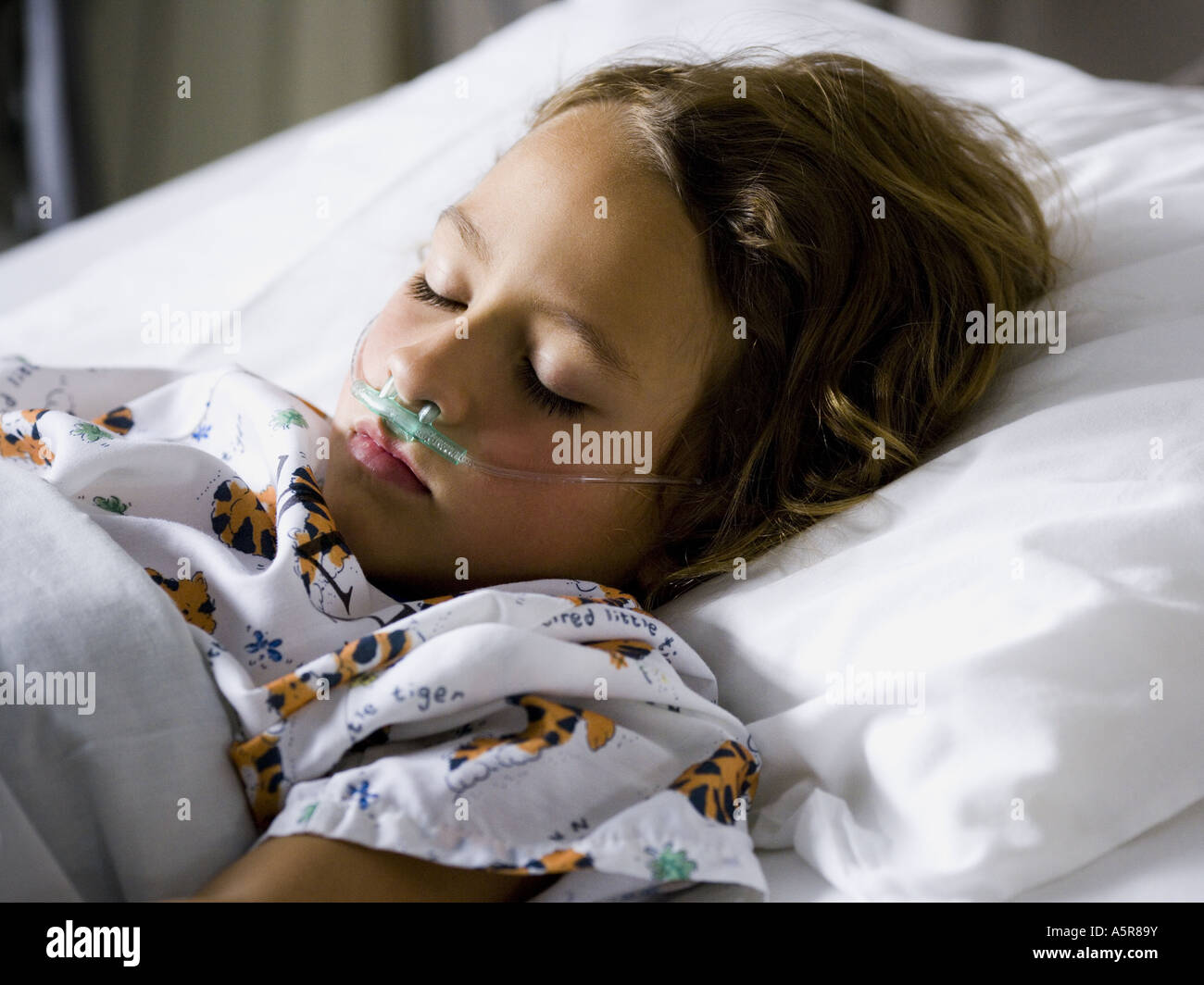Young girl in hospital bed with respirator Stock Photo Alamy