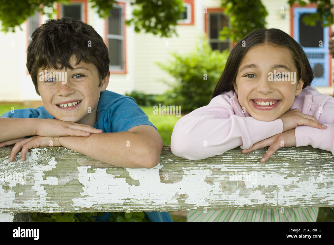 Portrait of a boy and a girl smiling Stock Photo - Alamy