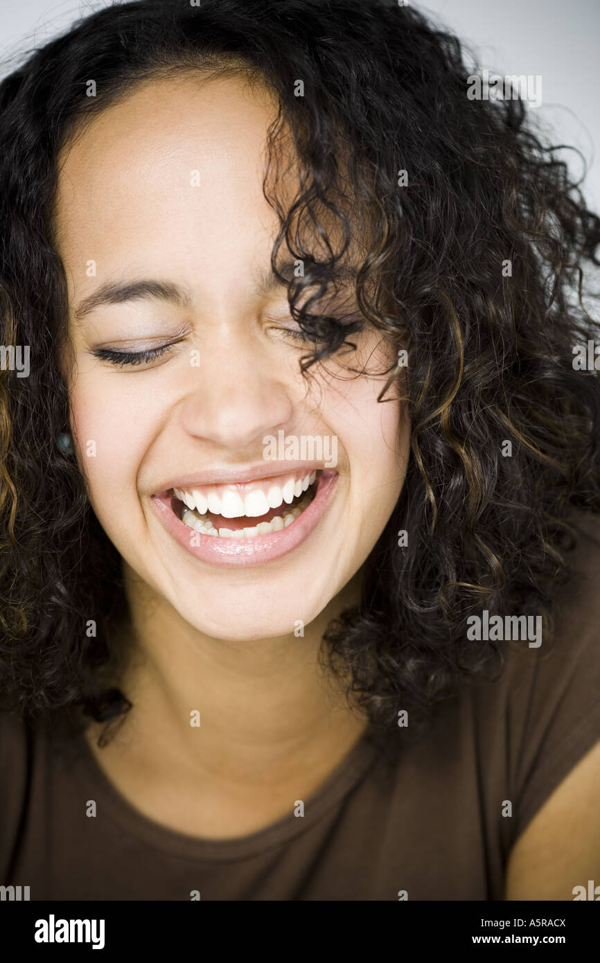 Woman smiling with eyes closed Stock Photo - Alamy