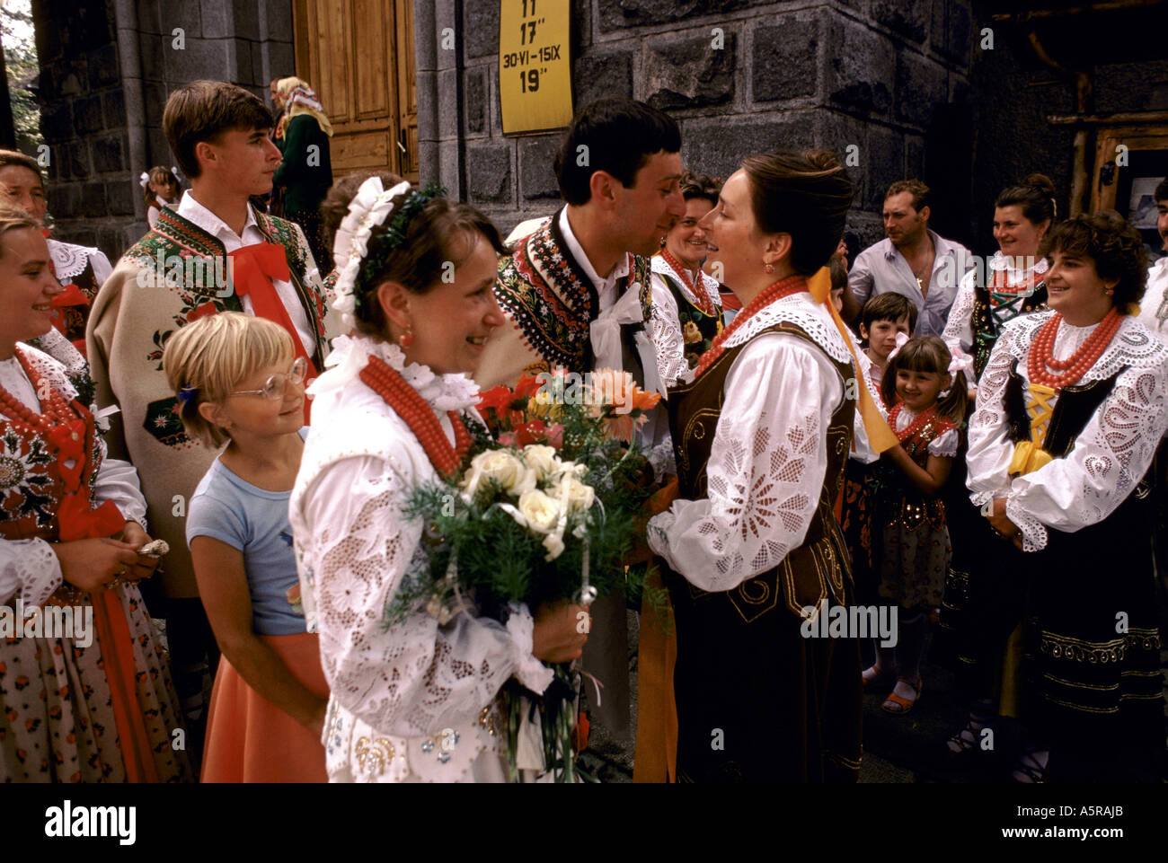 a traditional Gorale wedding in south west Poland, where the bride and groom greet the guest after the ceremony. Stock Photo