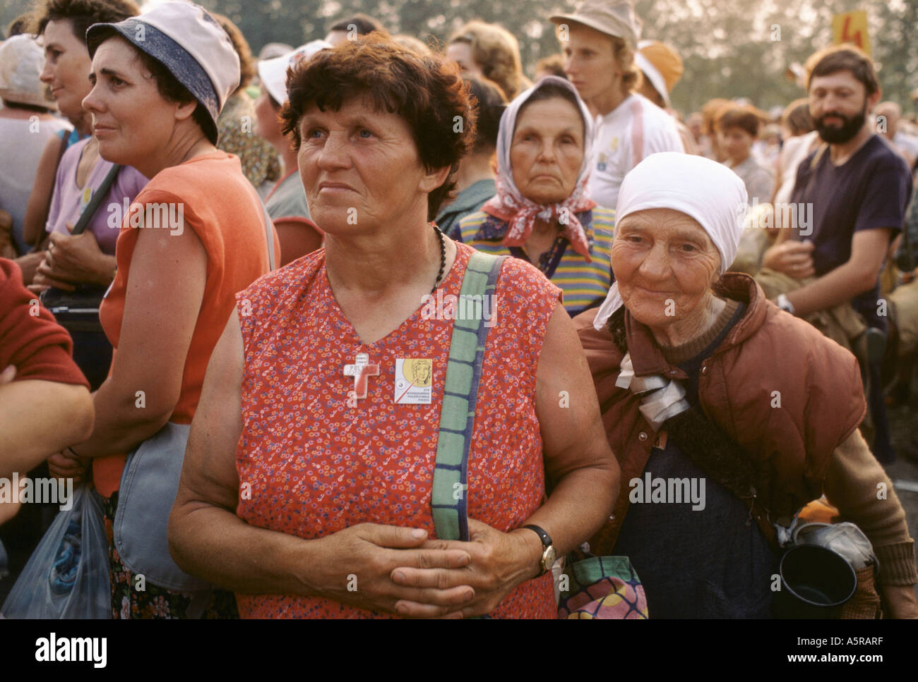 TWO WOMEN AMONGST CROWDS DURING PILGRAMAGE TO THE BLACK MADONNA, MSTOW, POLAND Stock Photo