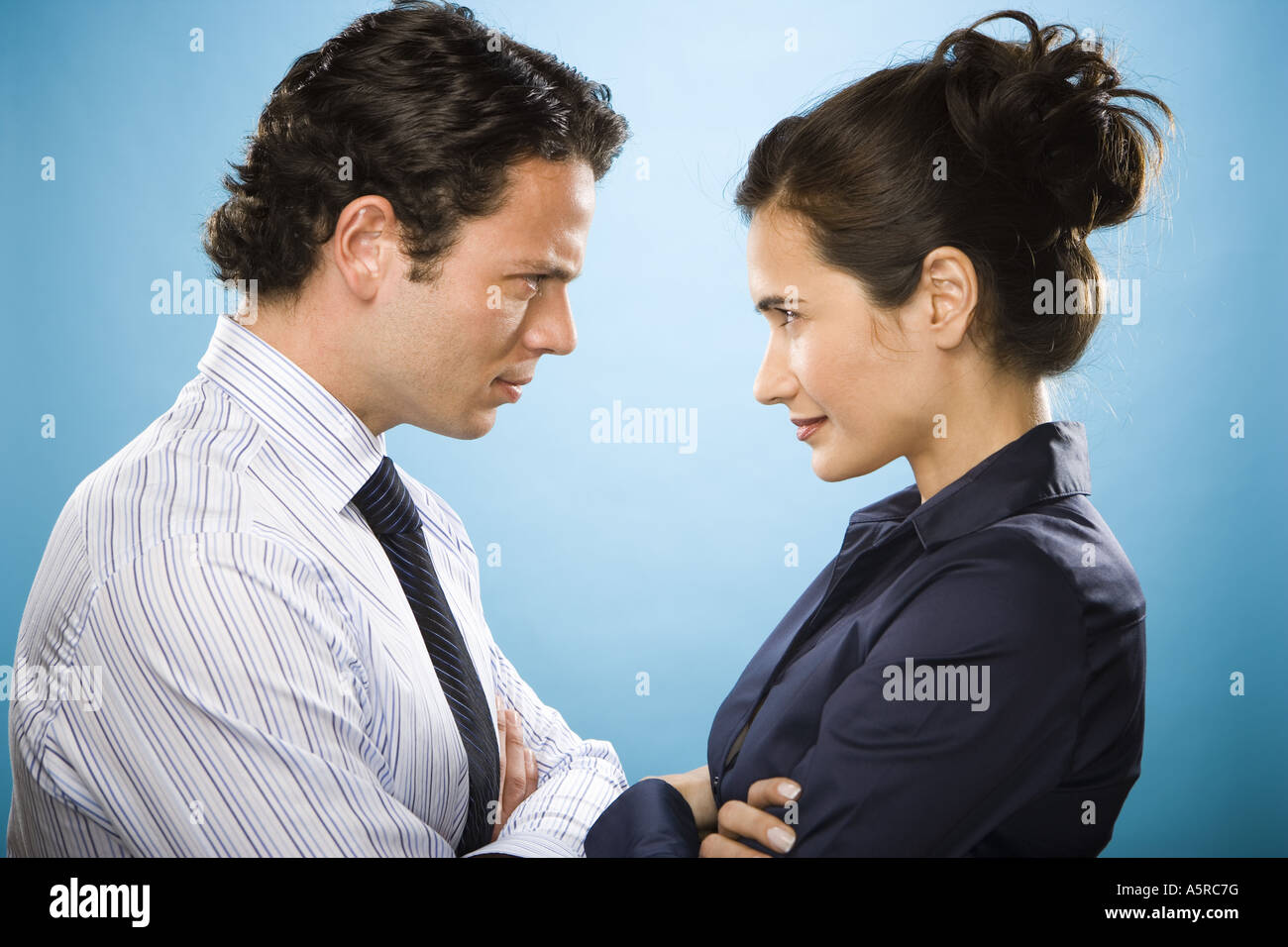 Profile of a young man and a woman looking at each other Stock Photo ...