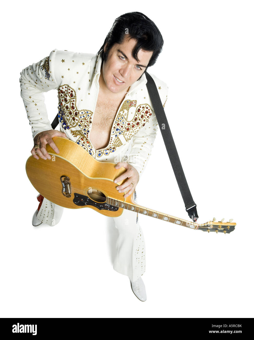 Overhead portrait of an Elvis impersonator holding a guitar Stock Photo