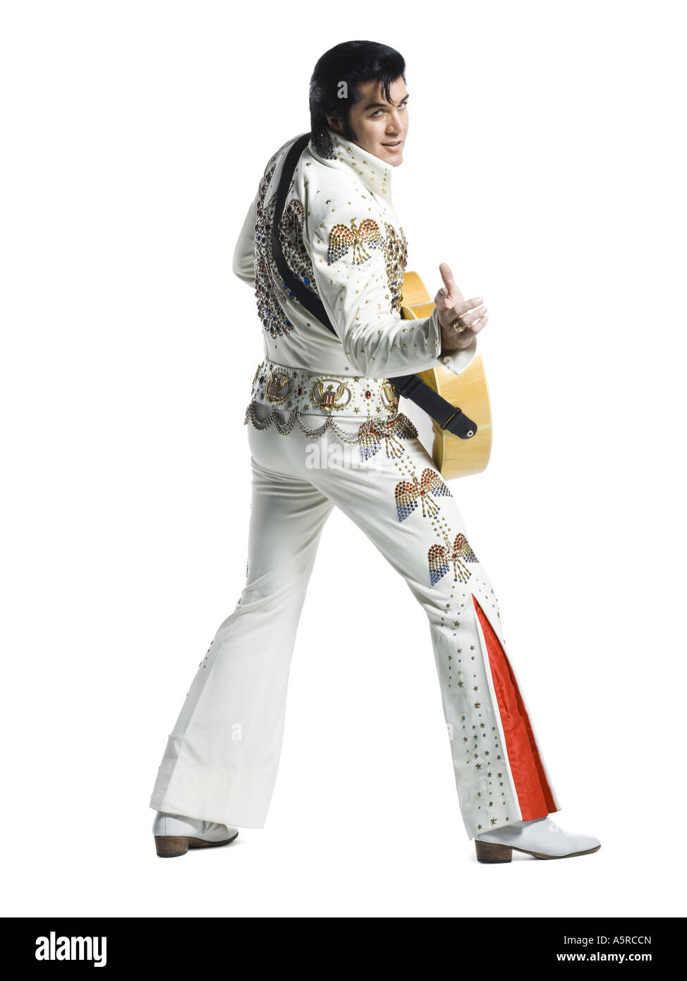 An Elvis impersonator holding a guitar Stock Photo