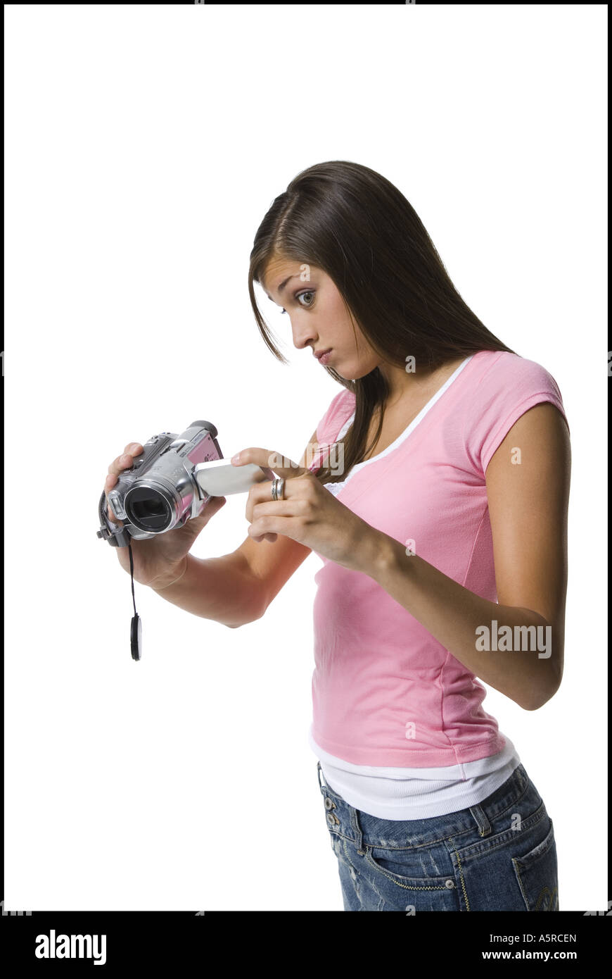 A young woman filming with a home video camera Stock Photo - Alamy