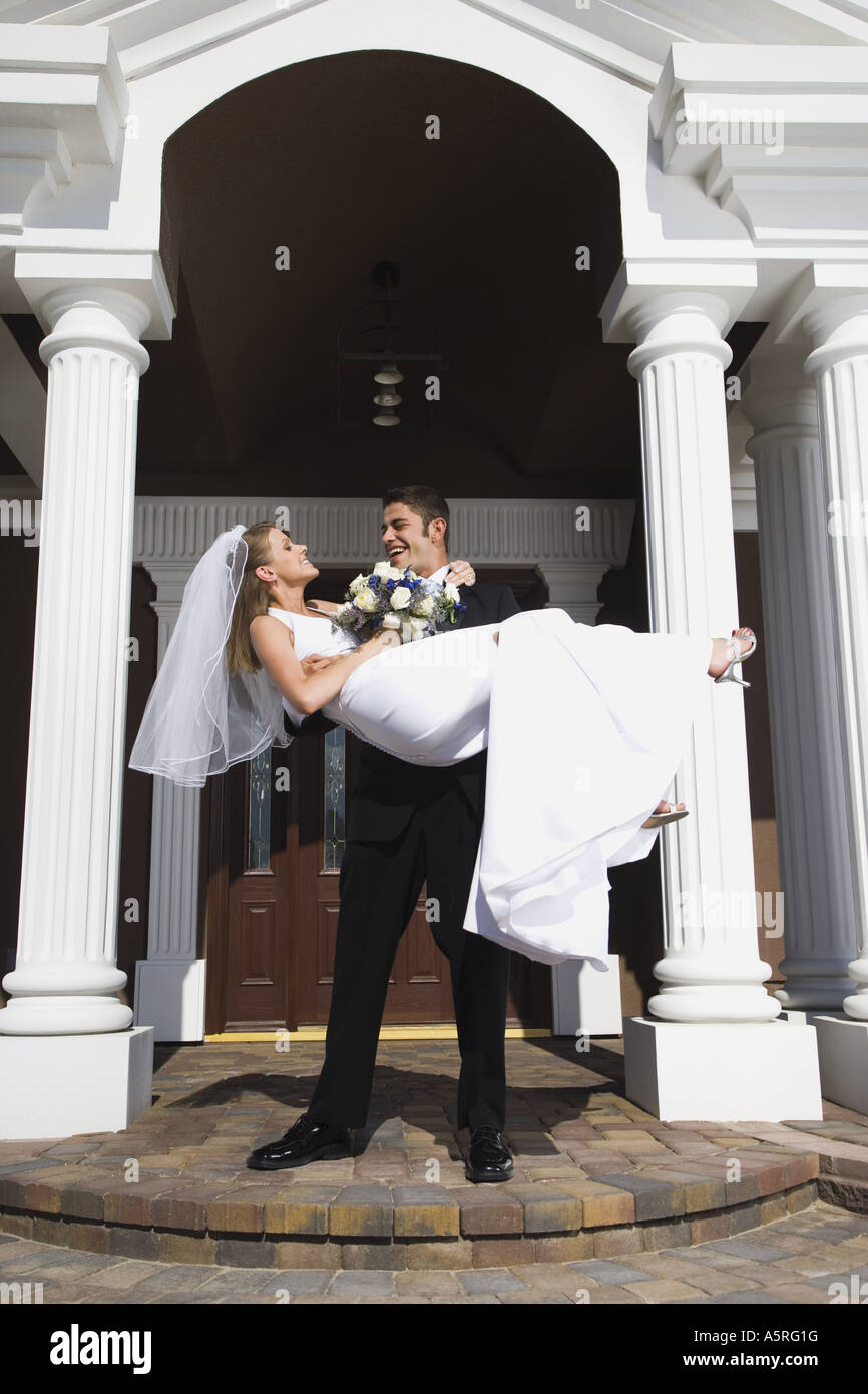 groom-carrying-bride-in-arms-hi-res-stock-photography-and-images-alamy