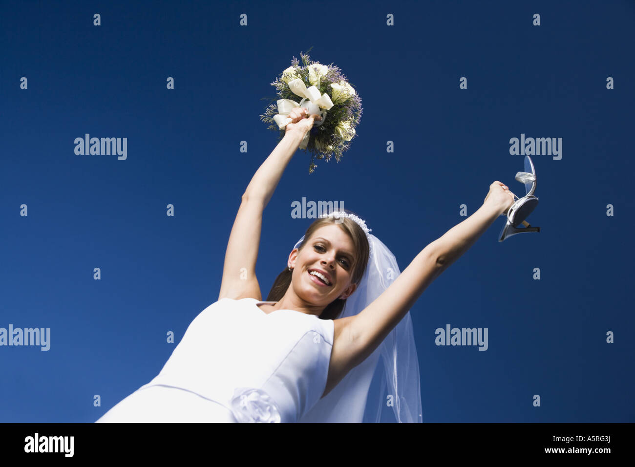 Cheerful bride holding bouquet hi-res stock photography and images - Alamy