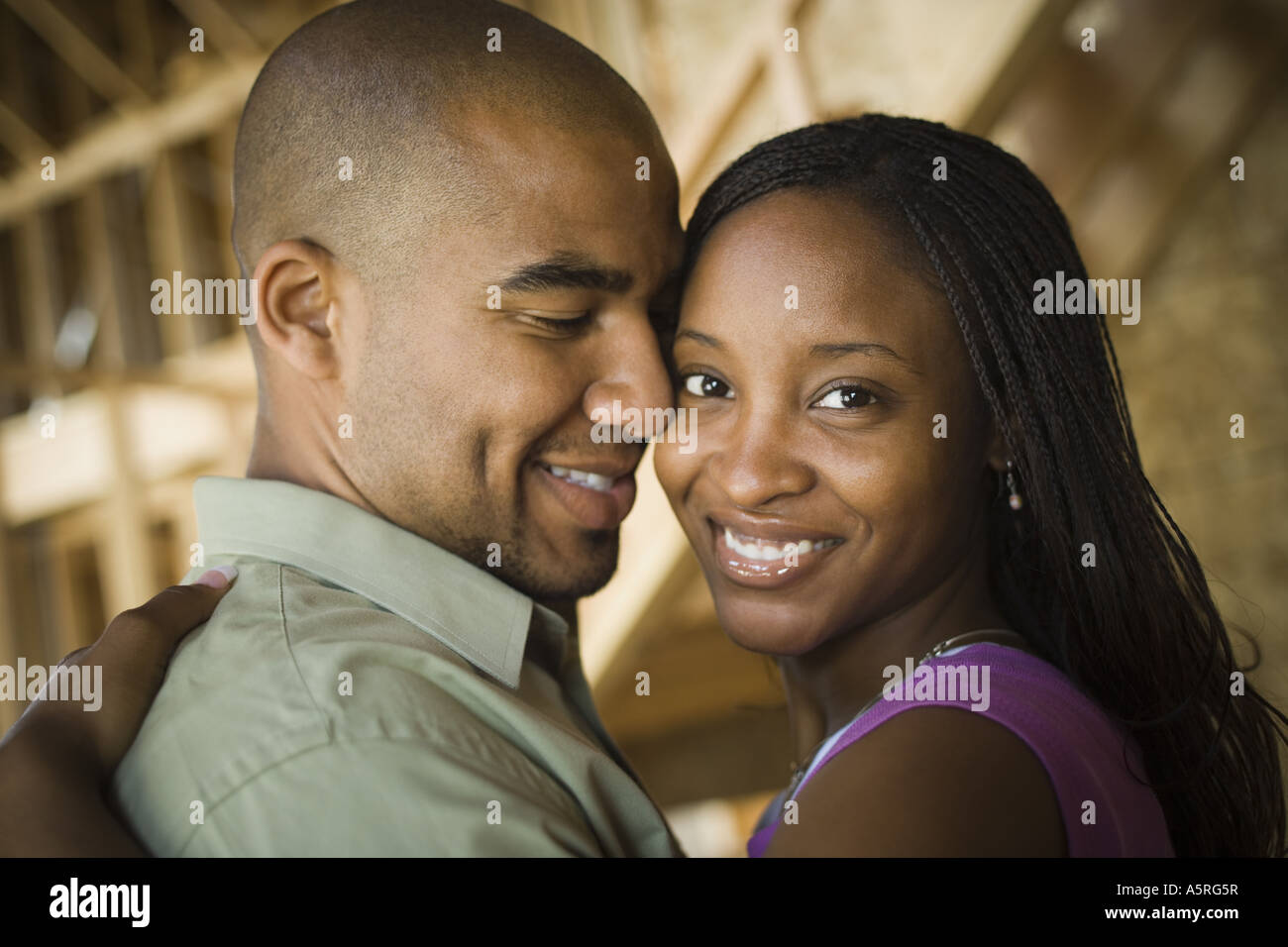 Close up of a young couple smiling Stock Photo - Alamy