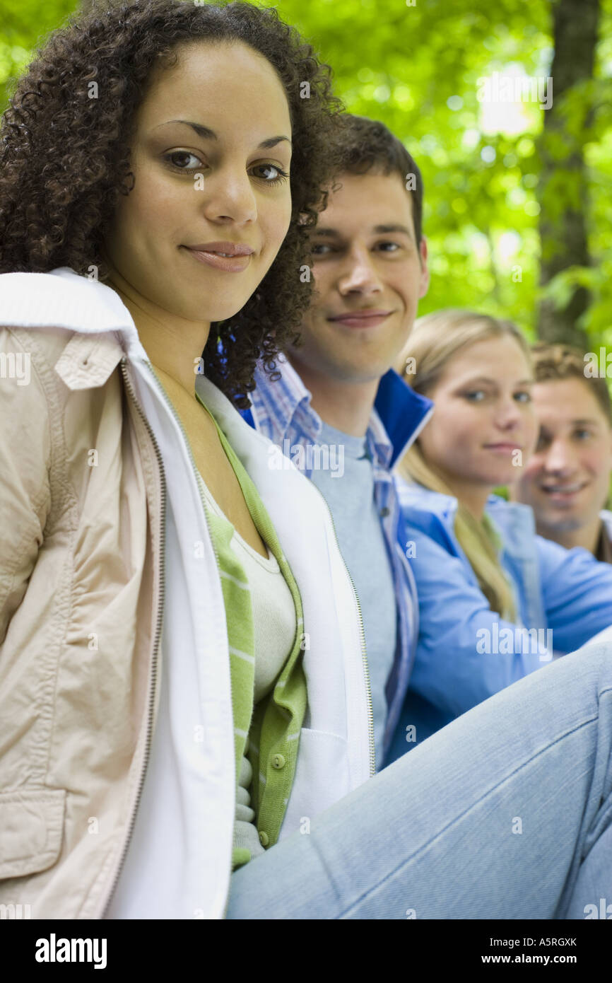 Portrait of two young women and two young men smiling Stock Photo - Alamy