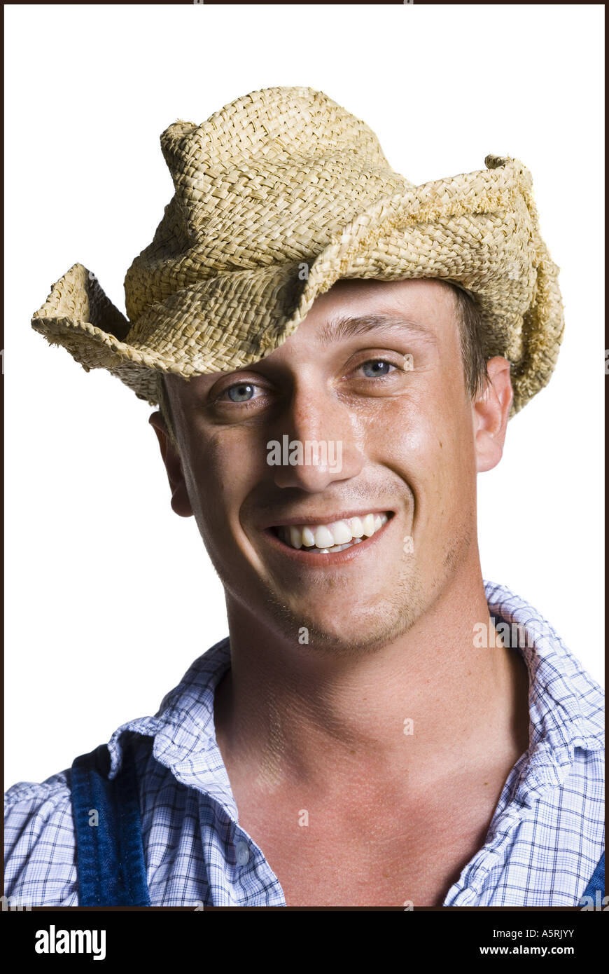 Farmer wearing a straw hat smiling Stock Photo - Alamy