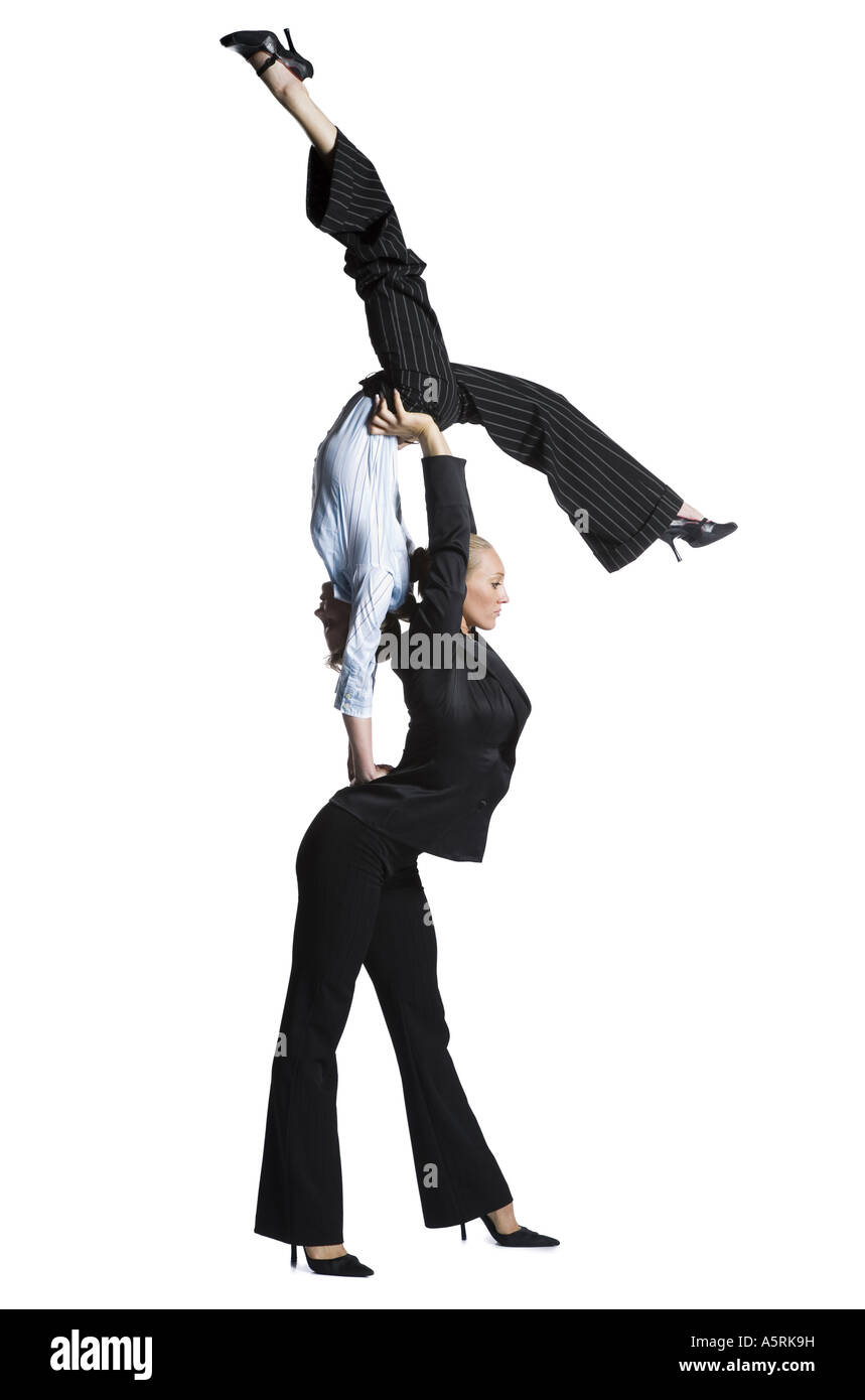 Two female contortionist businesswomen hires stock photography and