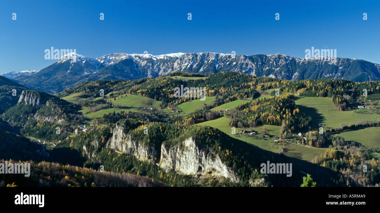 track of train to Semmering UNESCO world heritage leading across valley of Adlitzgräben in front of mountain Rax in Lower Stock Photo