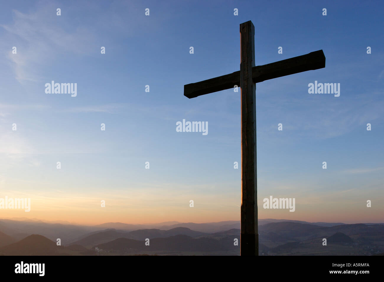 a wooden cross on the mountain Peilstein at sunset Lower Austria Stock Photo