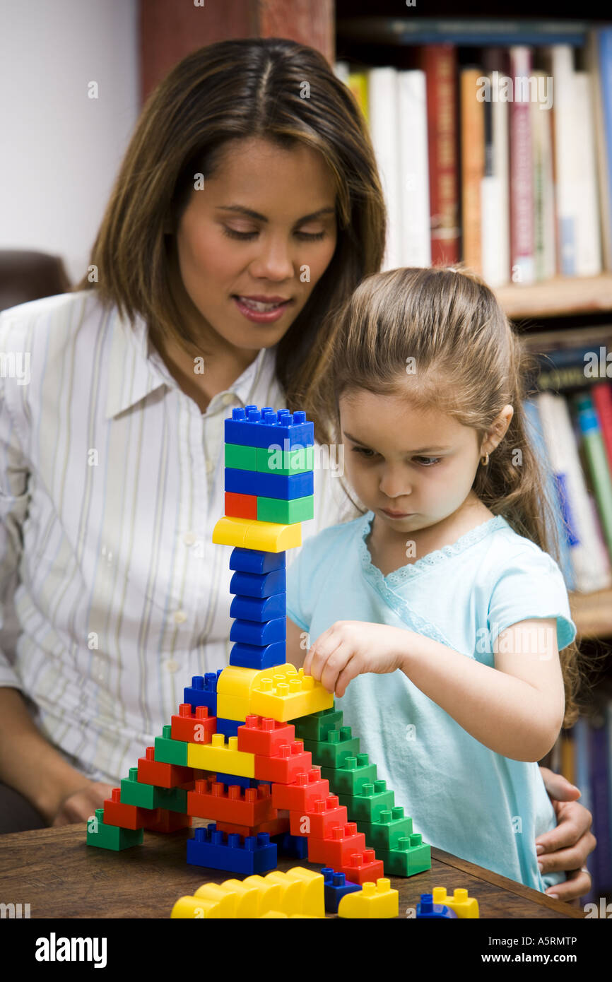 Mother and young daughter playing with building blocks Stock Photo Alamy