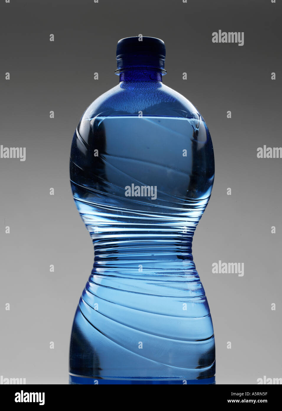 close up plastic bottle blue water plug drink bubble close liquid transparent Stock Photo
