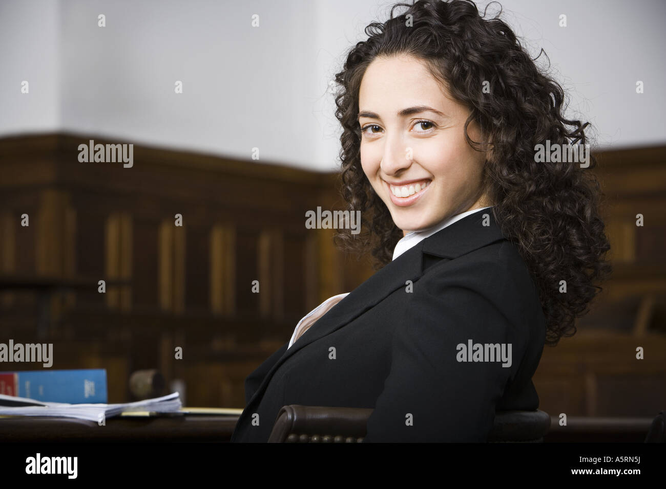 Female lawyer smiling in courtroom Stock Photo
