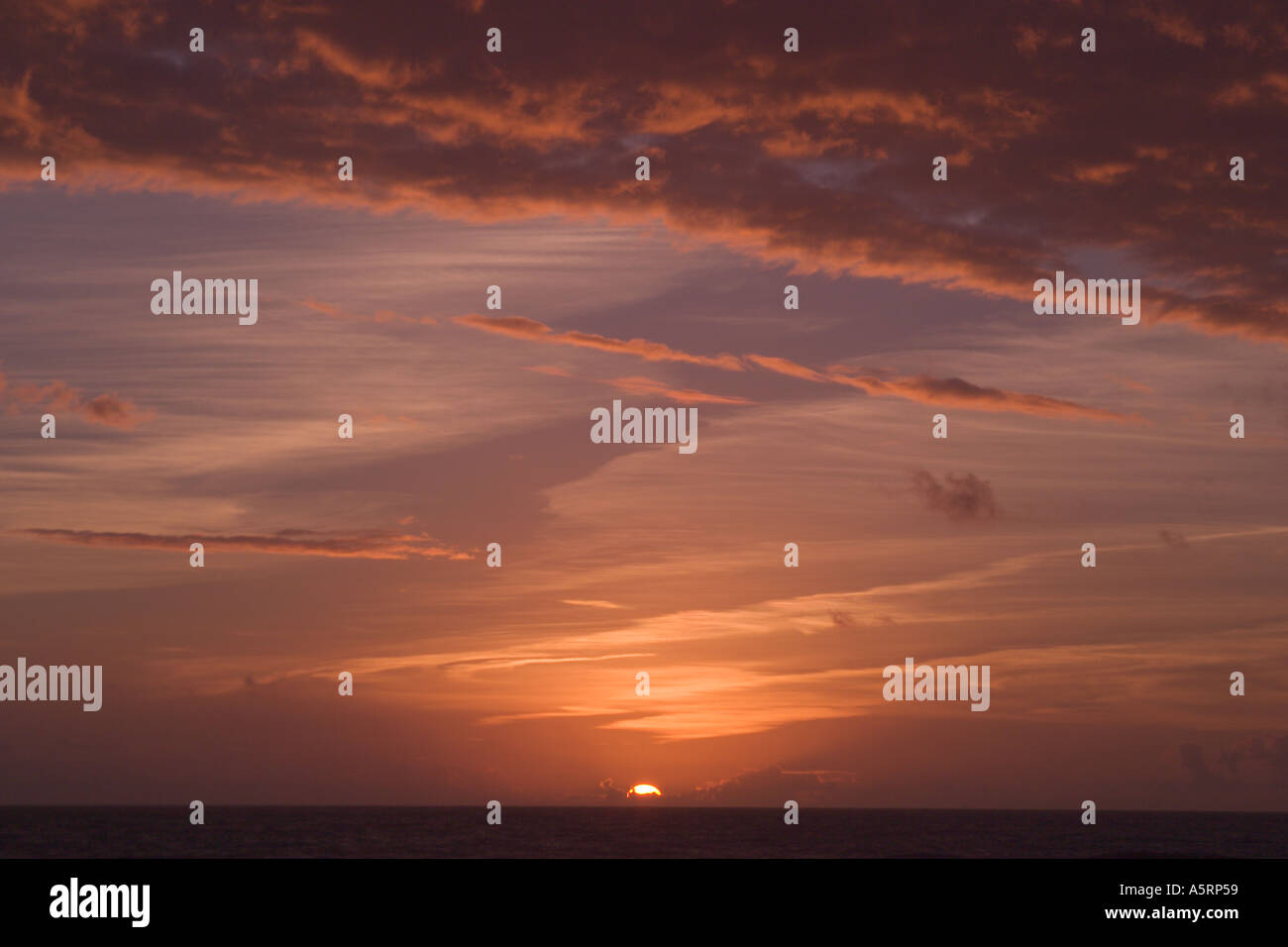 Sunrise or sunset in cloudy sky Stock Photo