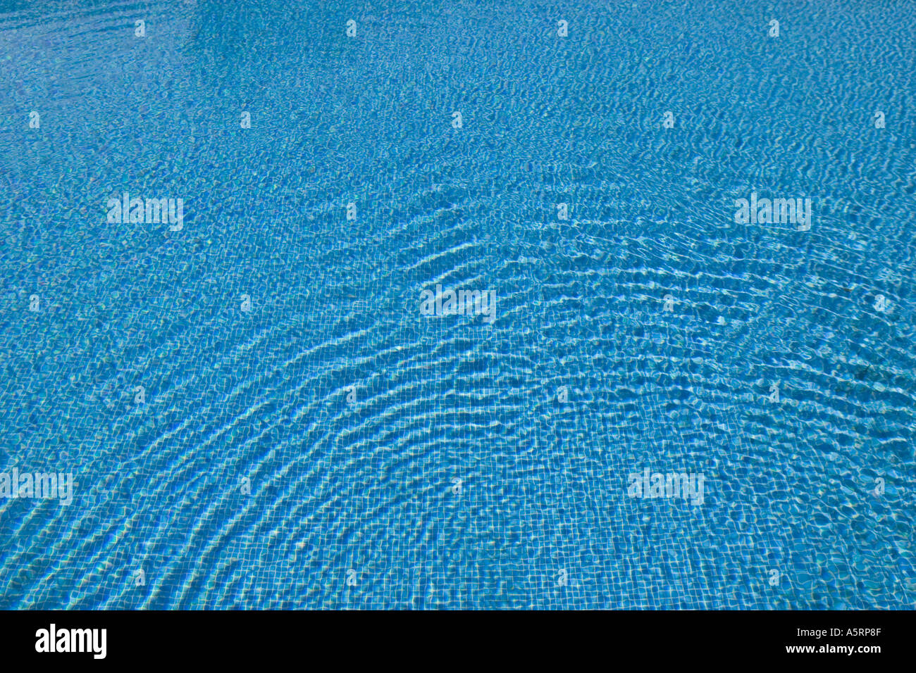 Pattern created by ripples in swimming pool Stock Photo
