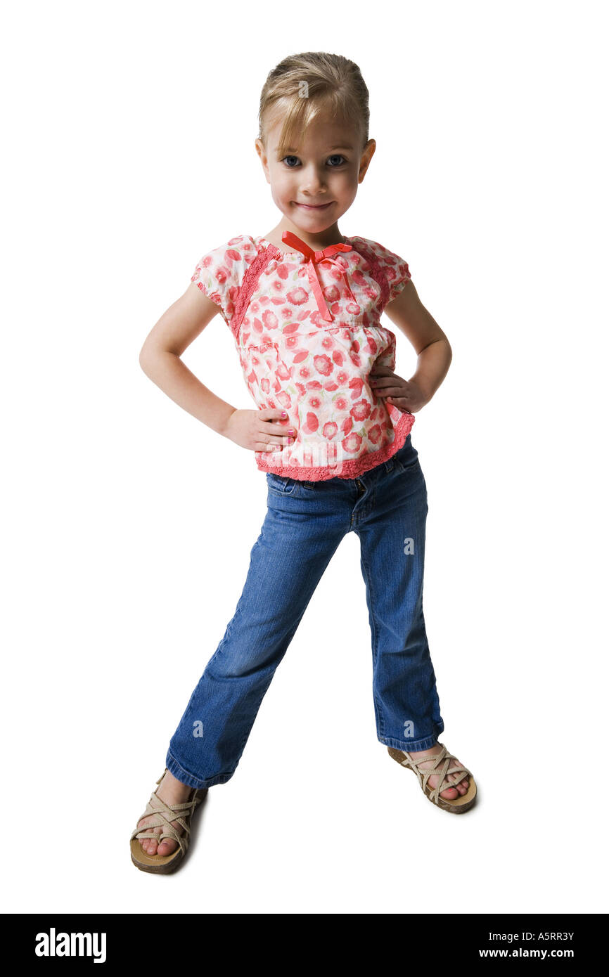 Young girl posing with hands on hips Stock Photo - Alamy