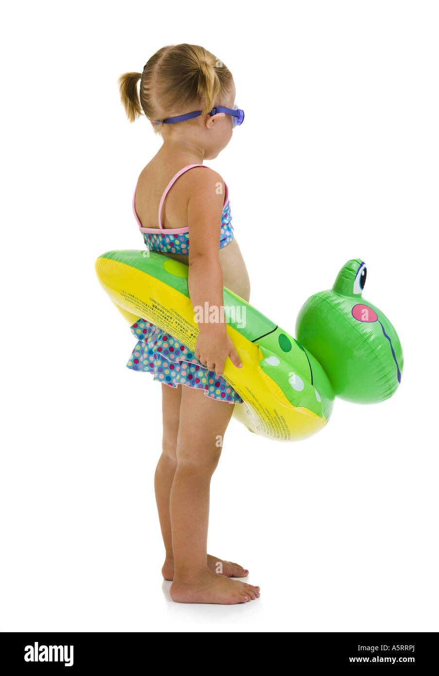 Young girl with inflatable flotation device around waist Stock Photo
