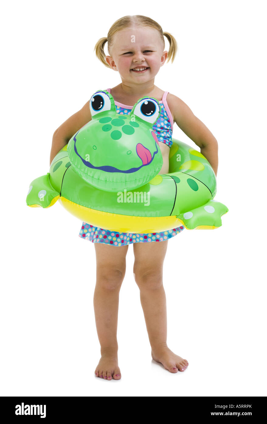 Young girl with inflatable flotation device around waist Stock Photo