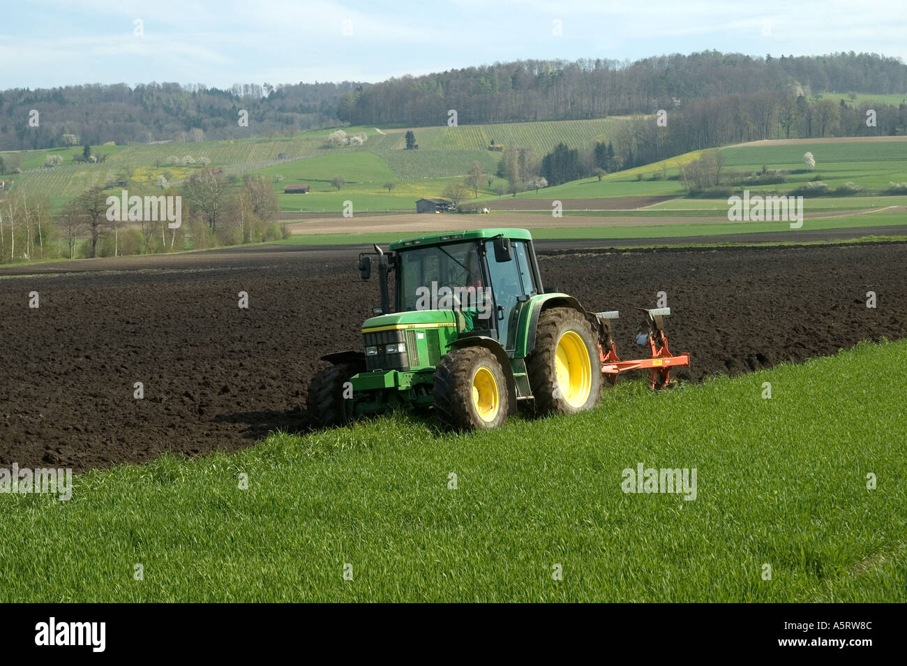 Ploughing in springtime near Schaffhausen Switzerland Stock Photo