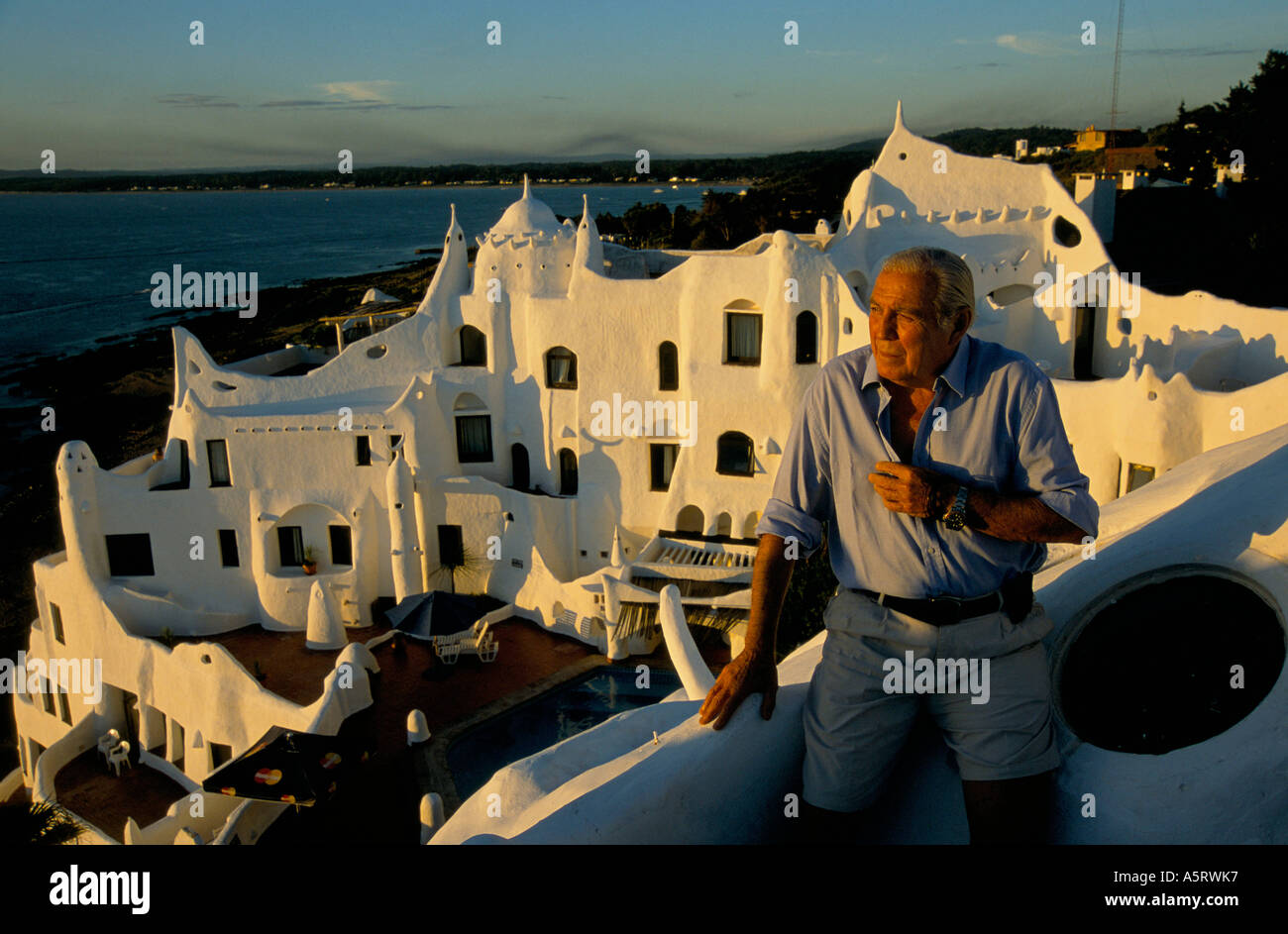 ARTIST CARLOS PAEZ VILARO ON HIS BALCONY OF THE HOUSE HE BUILT HIMSELF IN PUNTA DEL ESTE Stock Photo