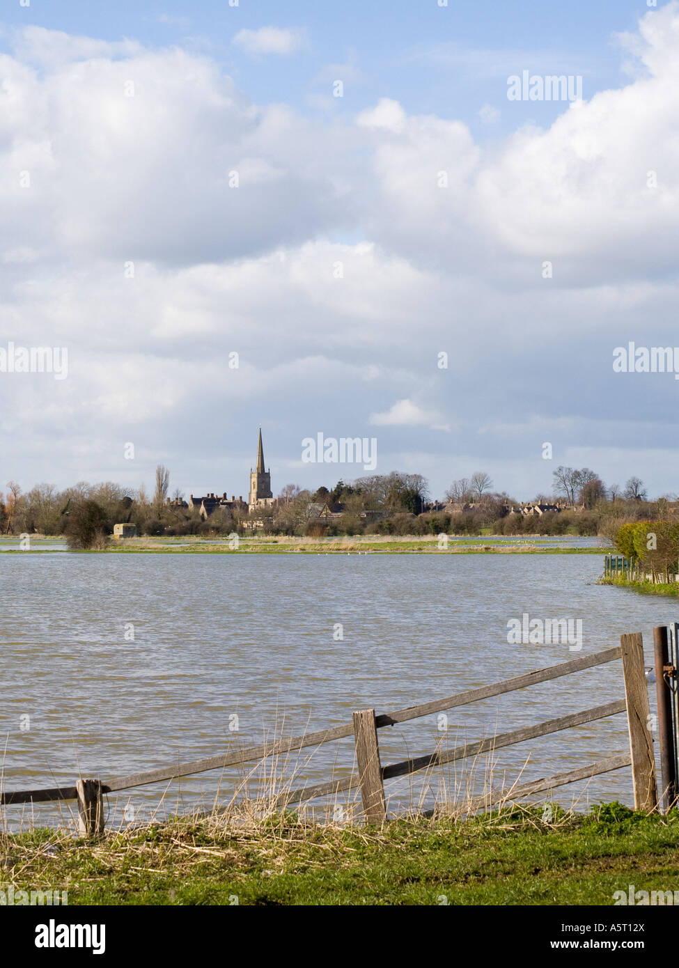 View across the river Thames in full flood towards Lechlade Gloucestershire UK Stock Photo