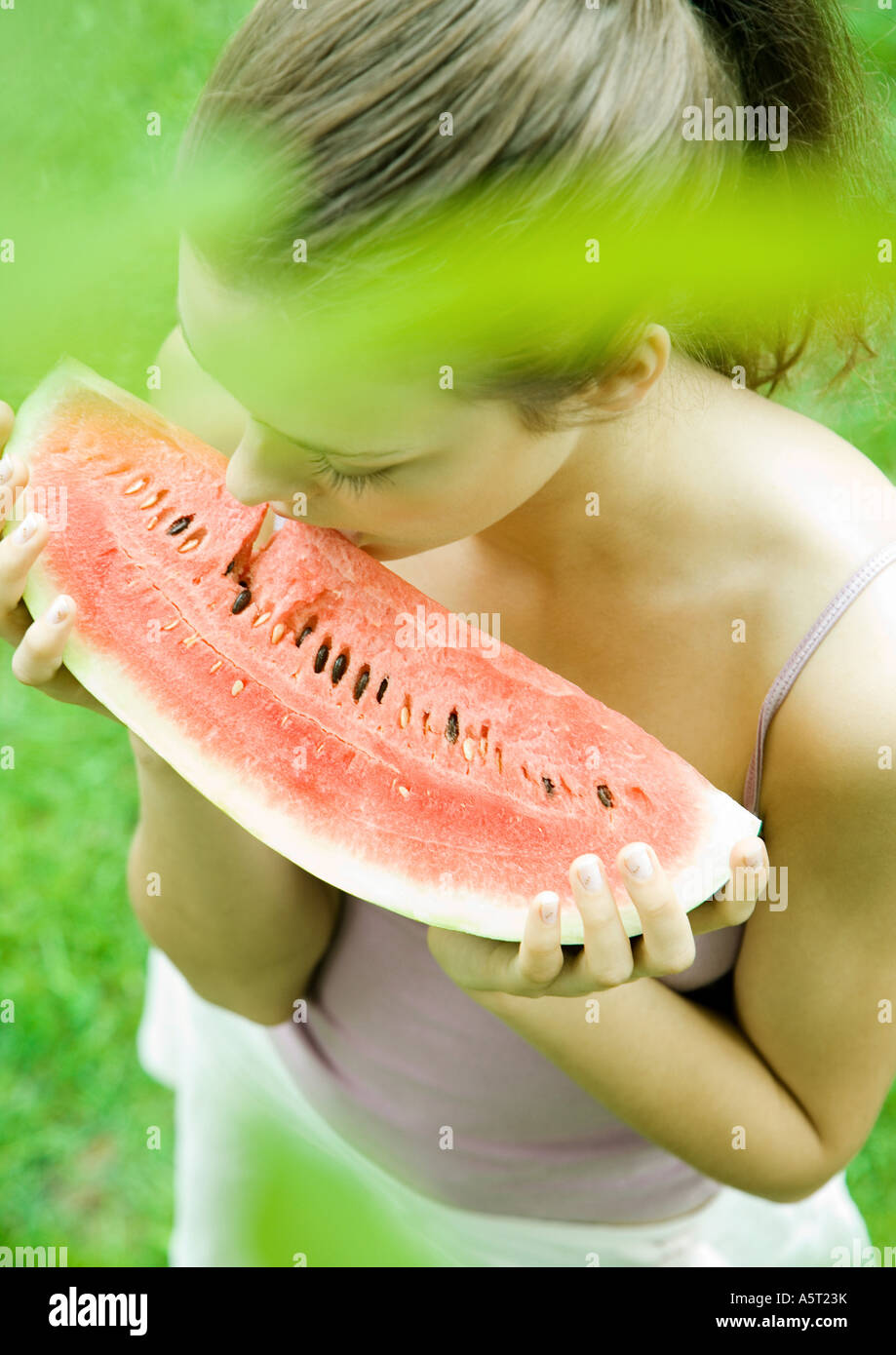 Woman holding slice of watermelon Stock Photo