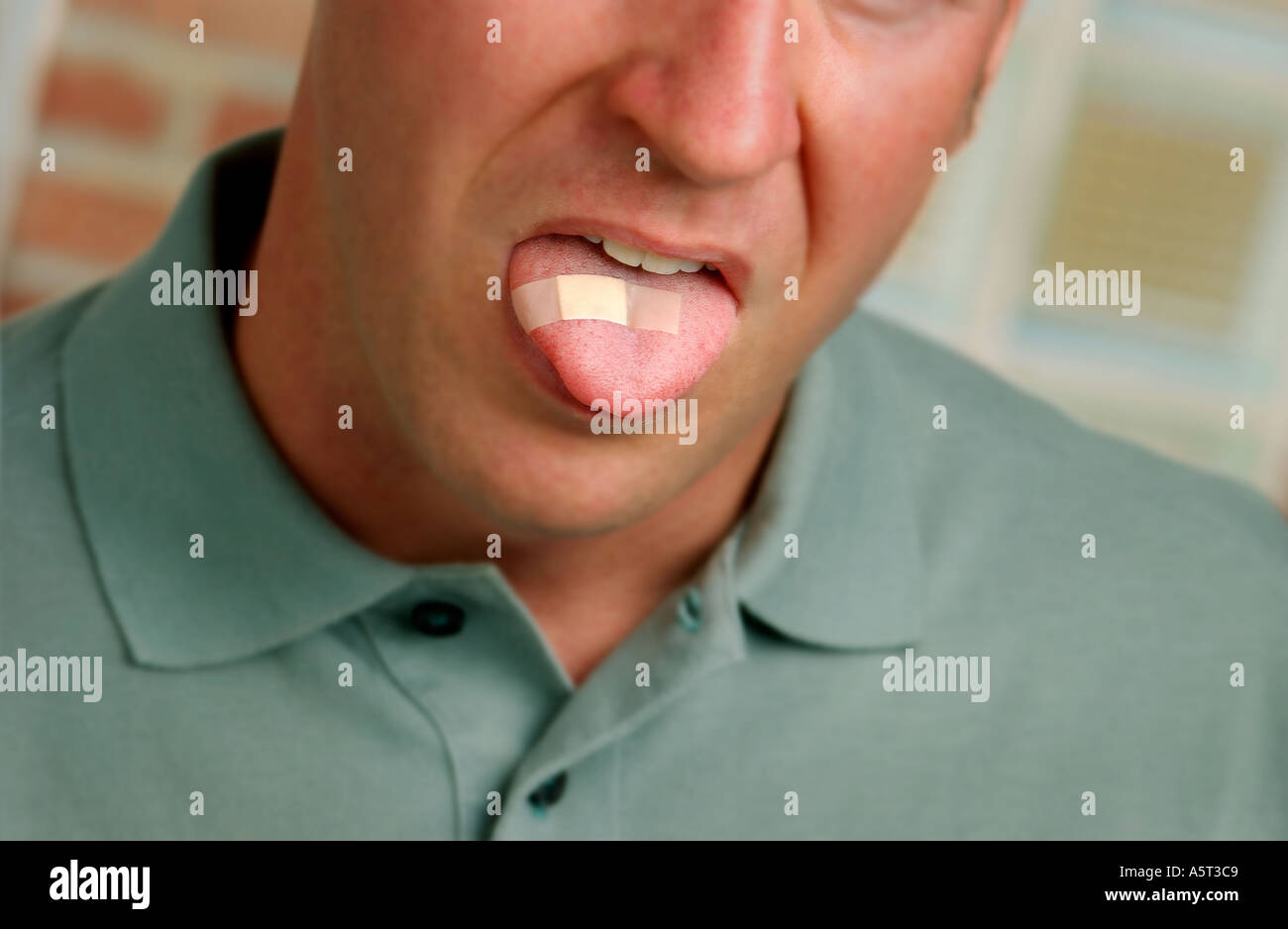 Caucasion man with bandage on tongue face partially visible Soft Stock