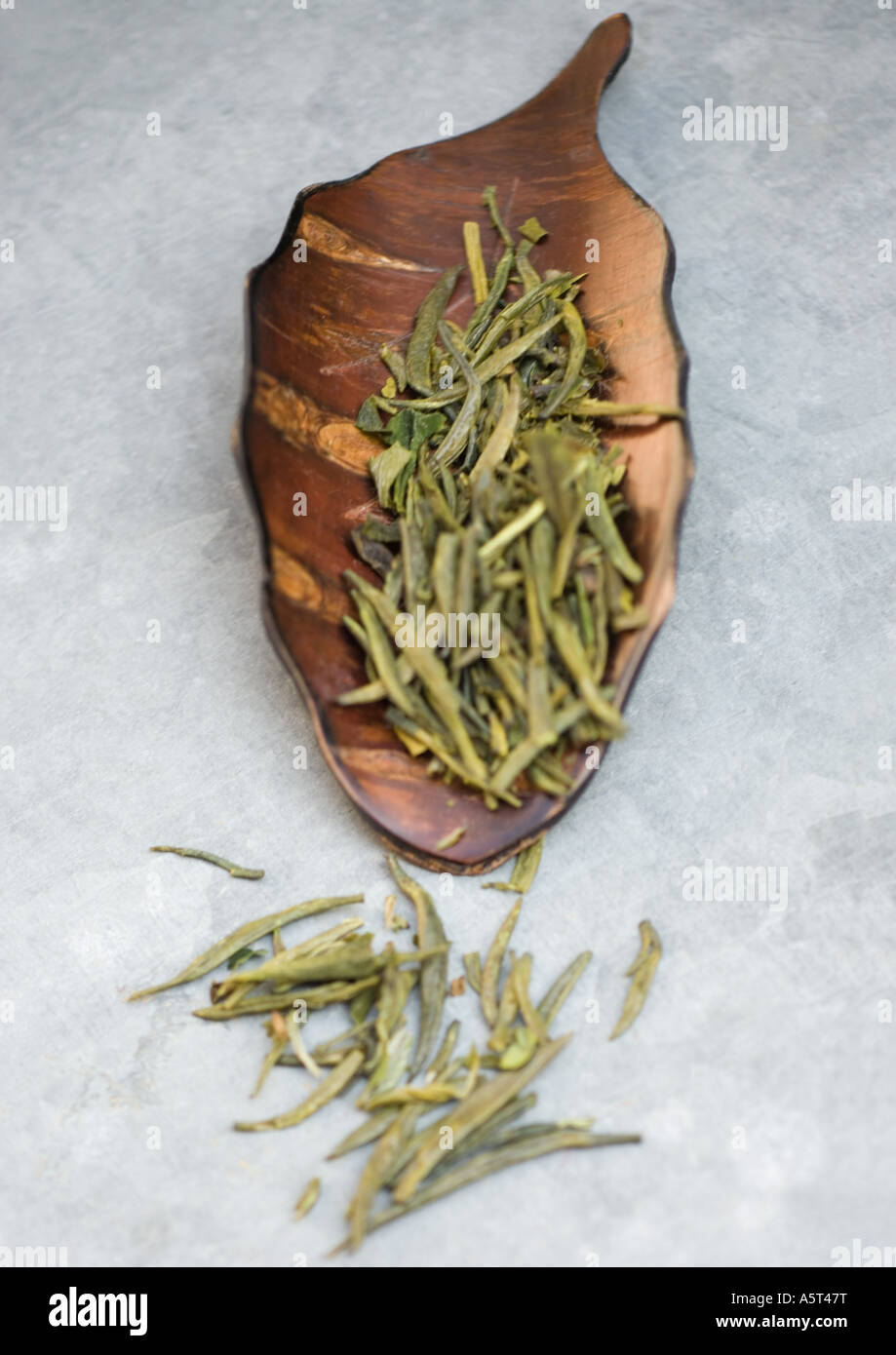 Green tea leaves in scoop Stock Photo Alamy