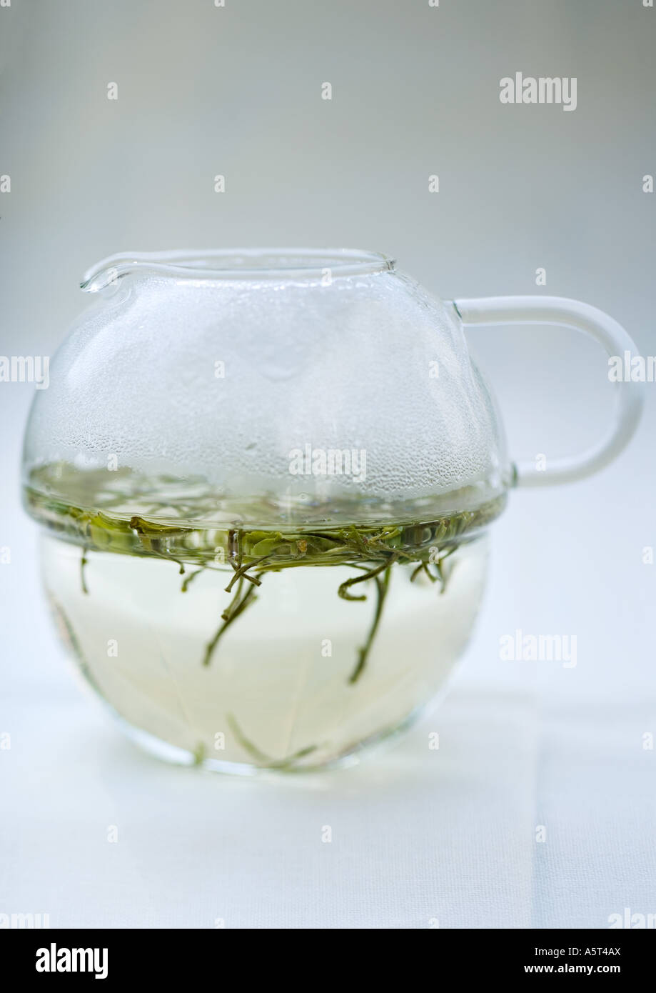 Green tea steeping in tea pot Stock Photo
