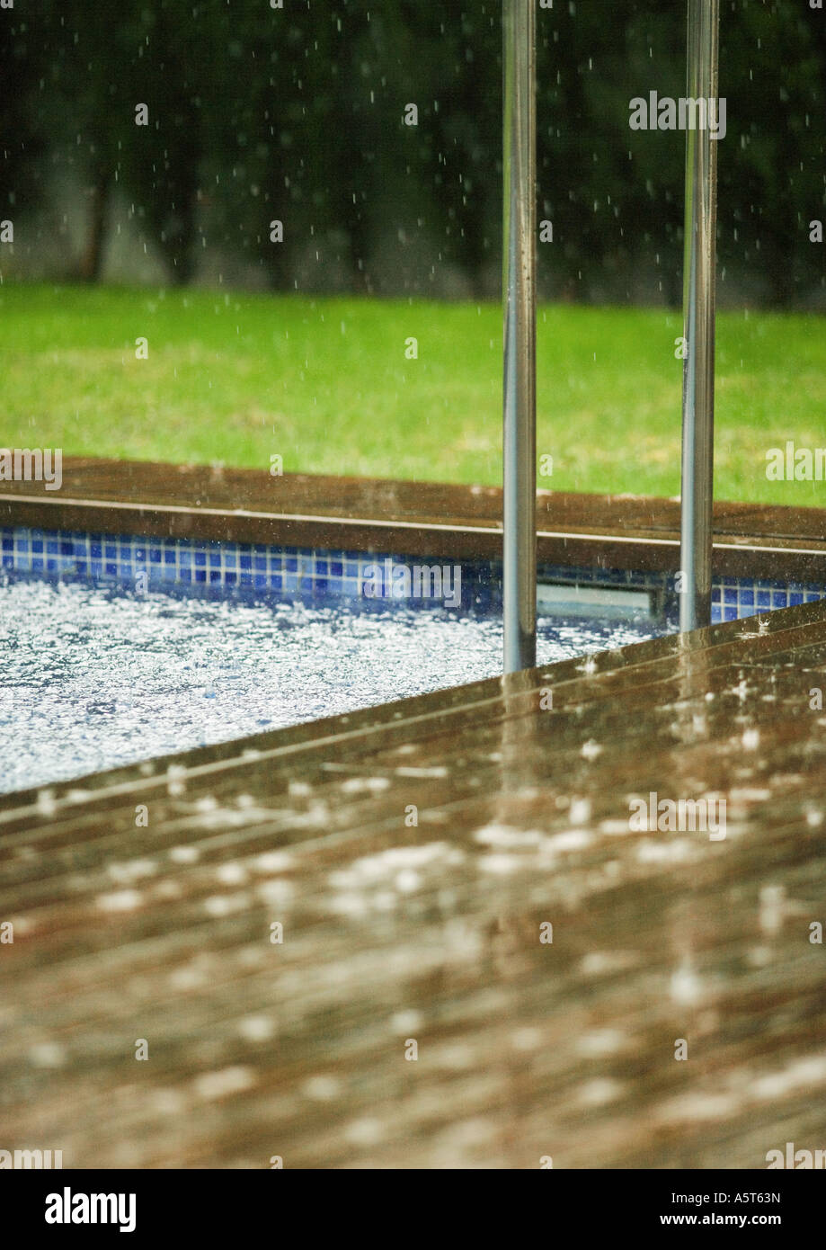 Swimming pool in rain Stock Photo Alamy