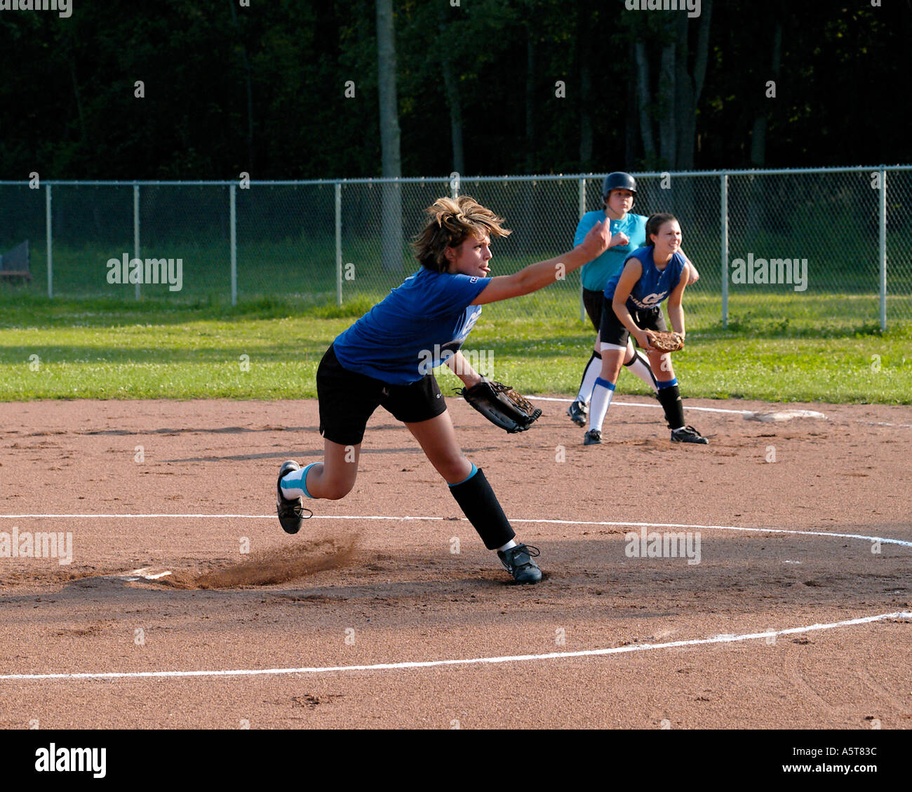 Youth girls softball pitcher in action Stock Photo - Alamy