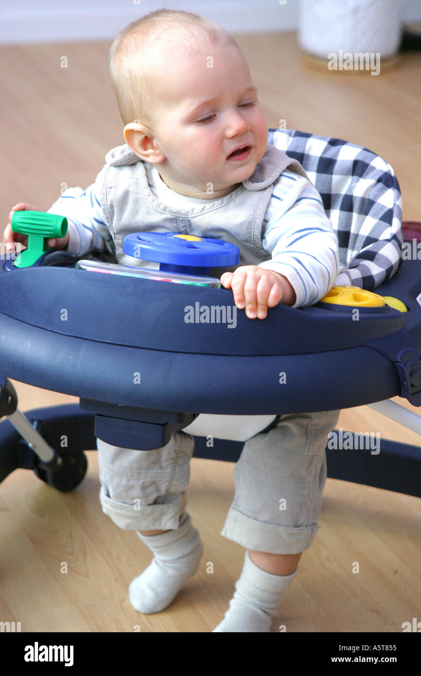 baby in walker Stock Photo Alamy