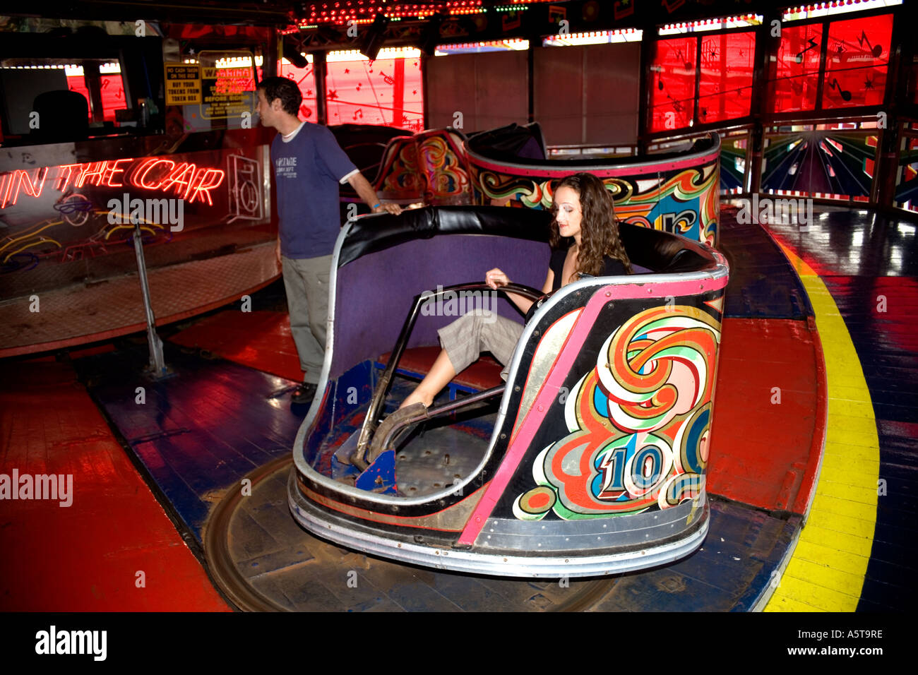 Girl on a waltzer at the fun fair on South pier,Blackpool, Lancashire