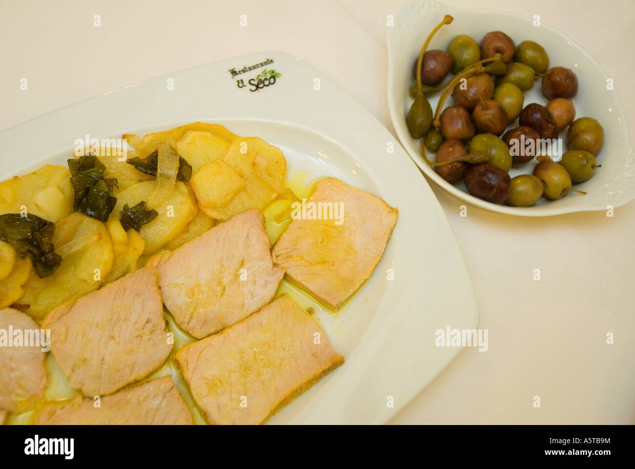 loin with potatoes olives El Seco restaurant UBEDA Jaen province Andalusia region Spain Stock Photo
