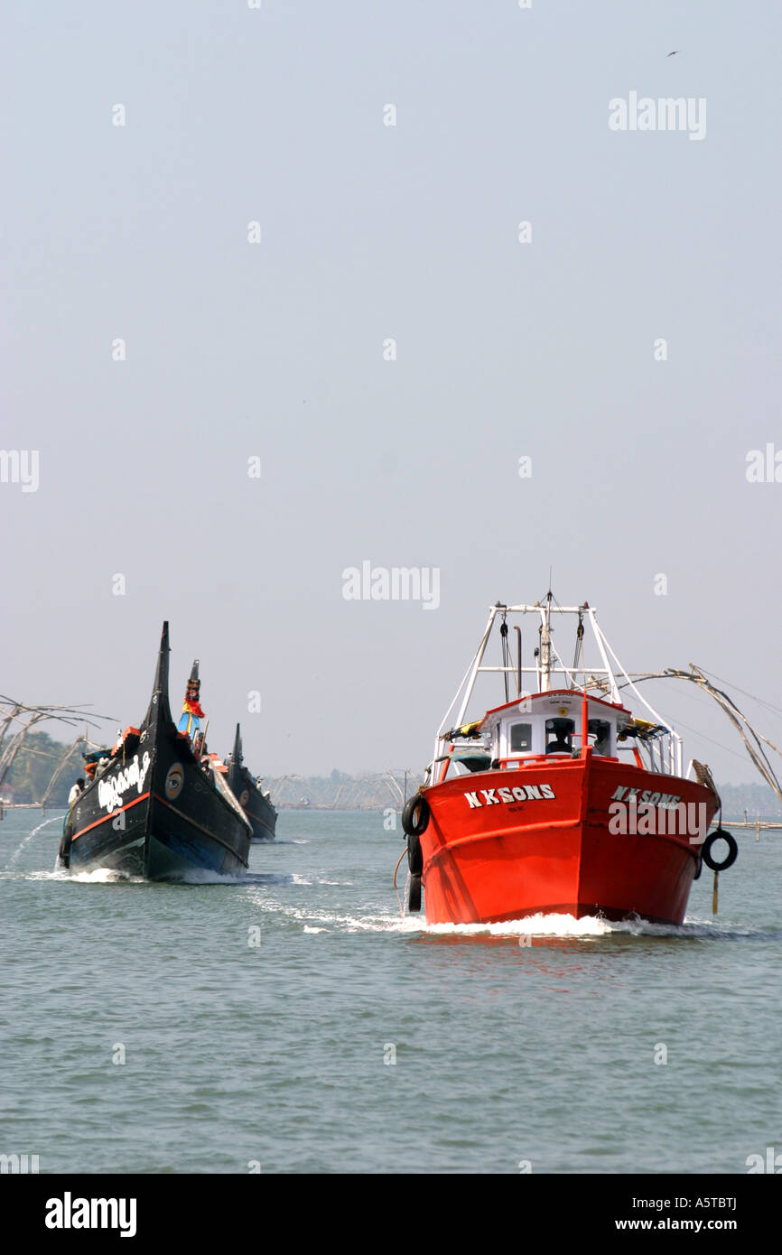 Fishing boats head out to sea from the Kerala backwaters at Kerala