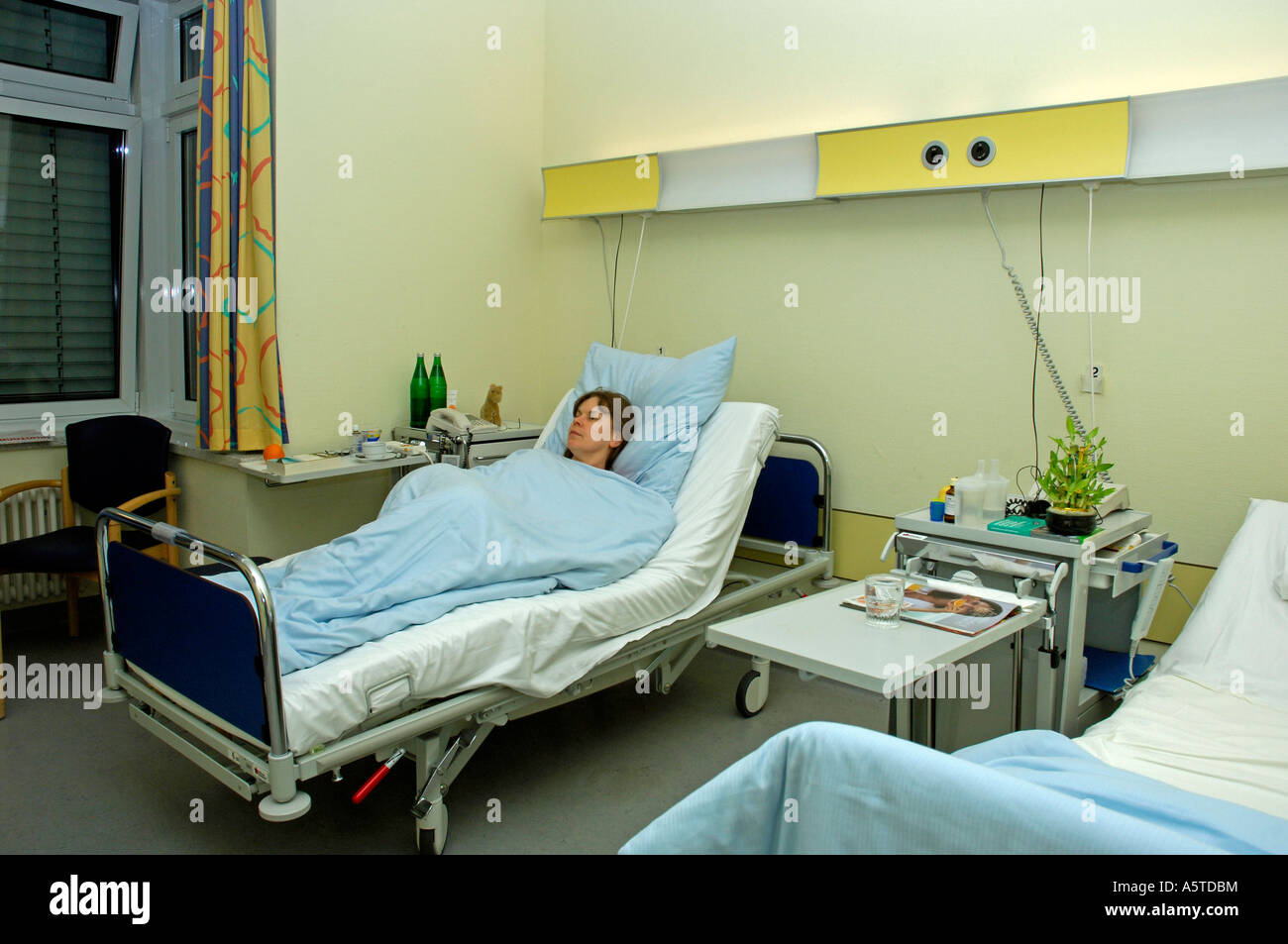 ill woman in hospital Stock Photo