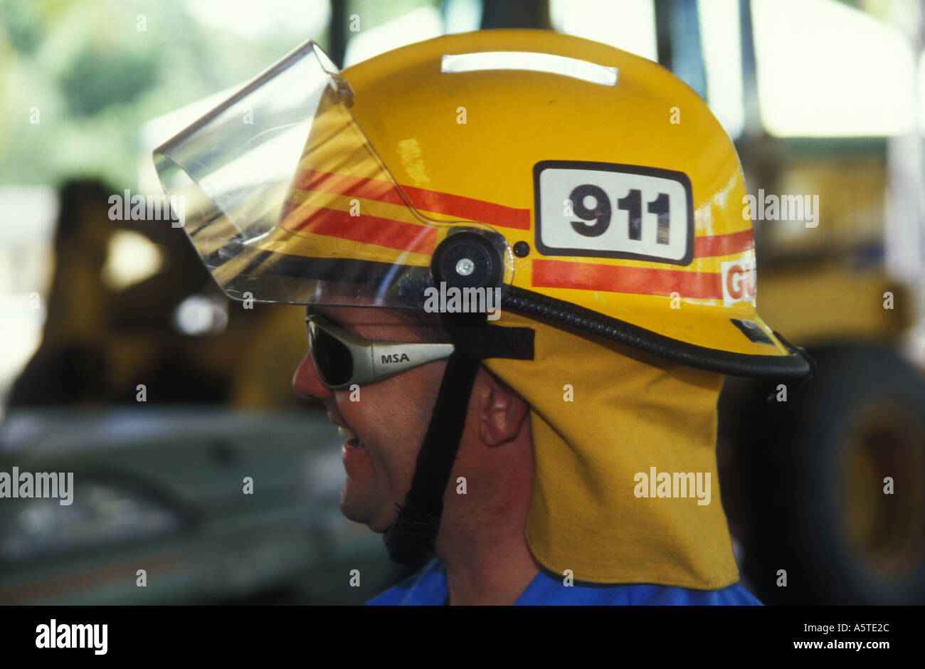 Queensland fireman face protective mask gear smiling happy Stock Photo