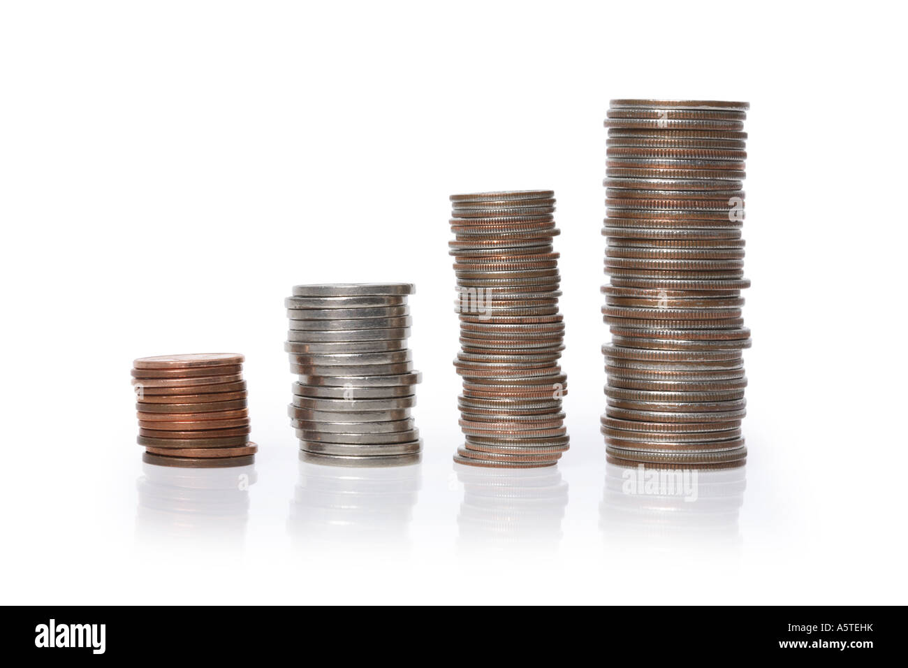 Stacks of Coins cut out on white background Stock Photo