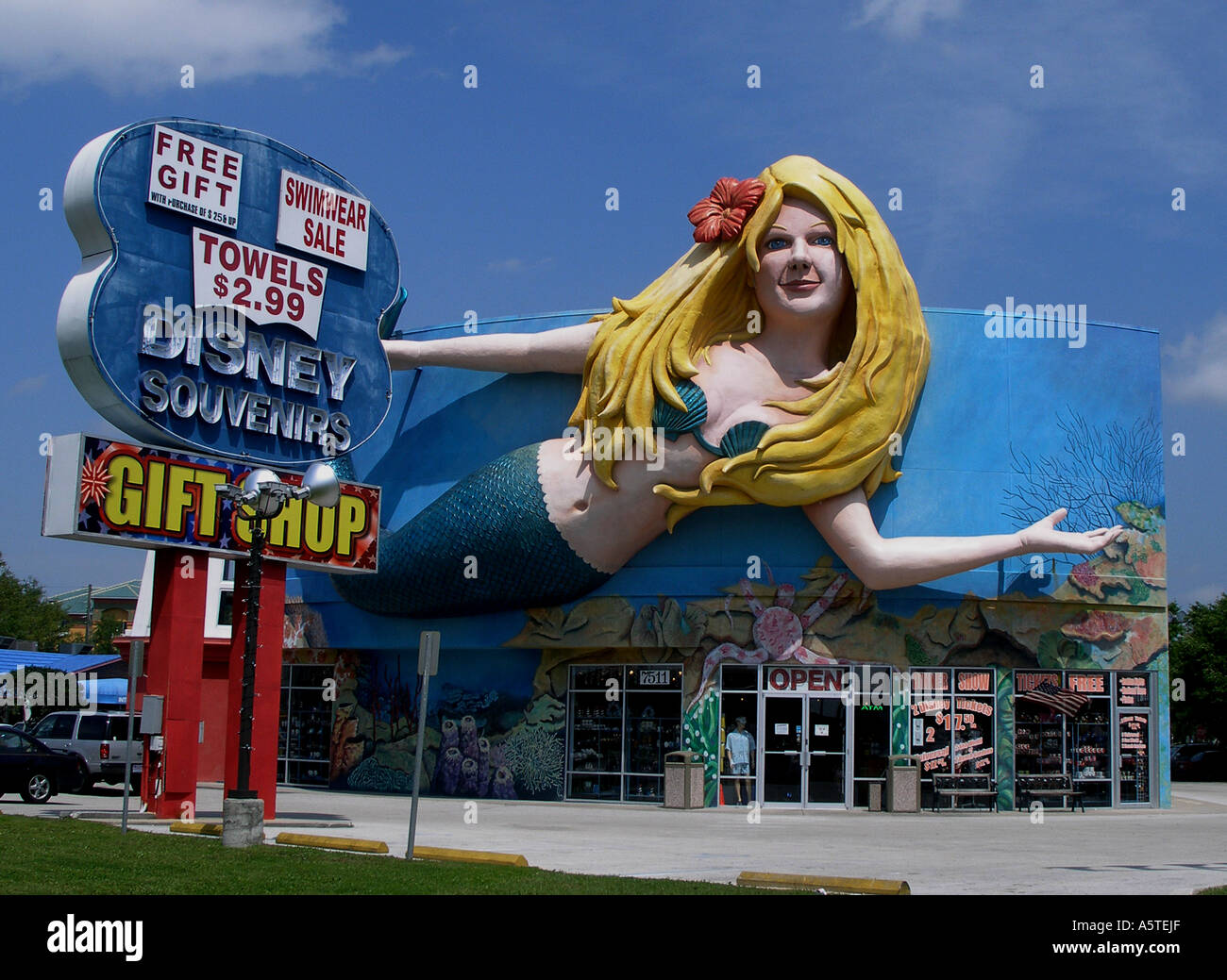 A giant mermaid appears to swim over a souvenir shop near the Disney  attraction near Orlando, Florida Stock Photo - Alamy
