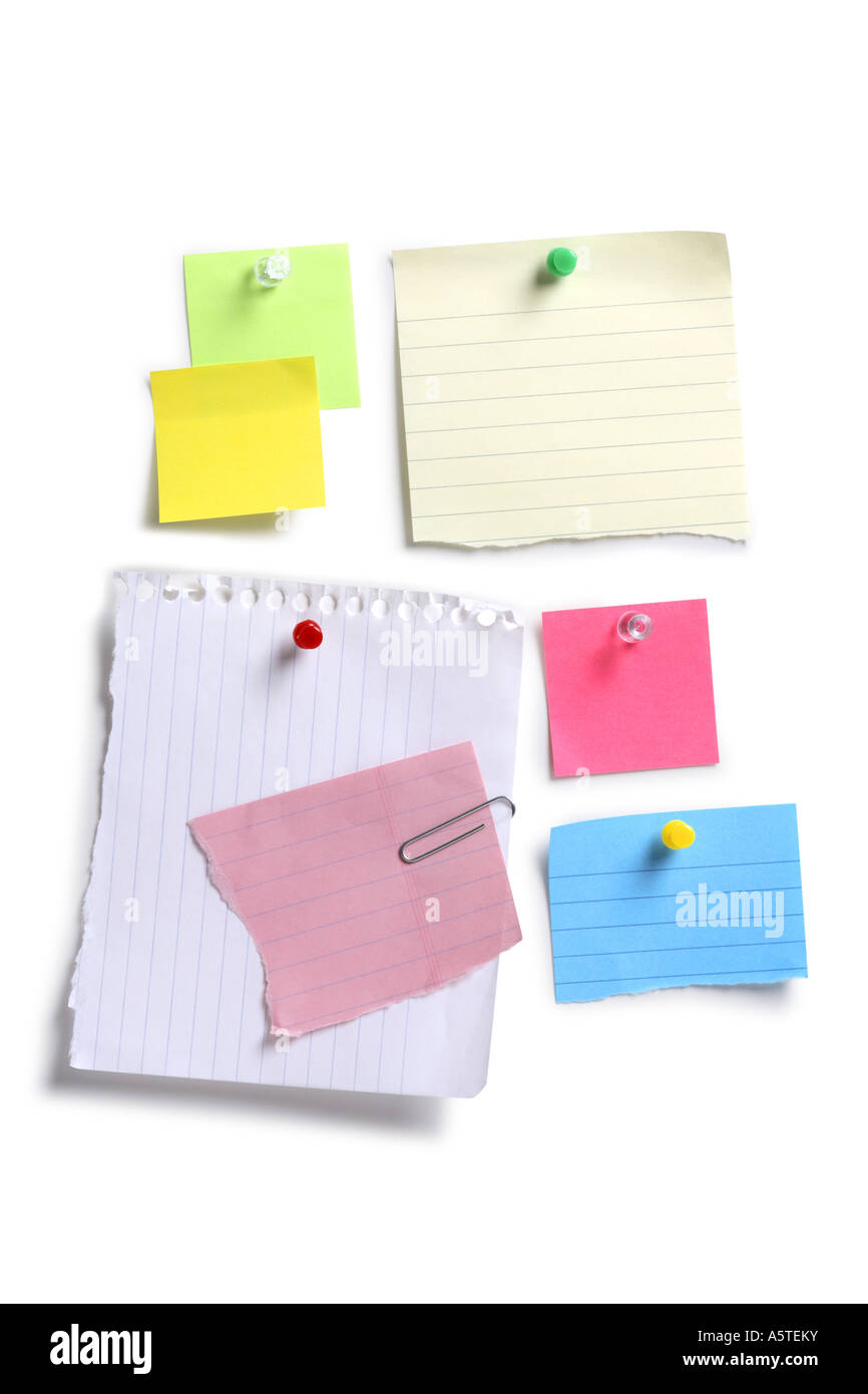Various sizes and colors of paper notes cut out on white background Stock Photo