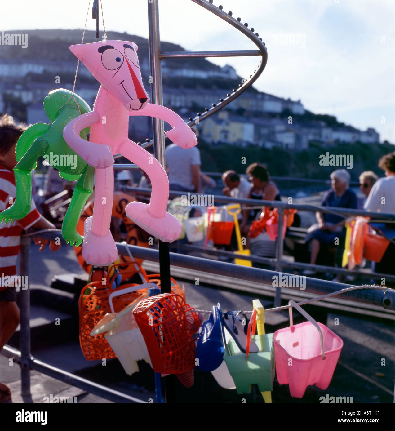 Inflatable pink panther on sale at a beach toy shop, New Quay, Wales, UK  KATHY DEWITT Stock Photo